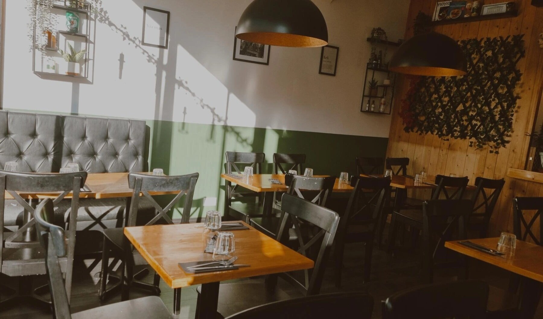 Inside Meat the Greeks at No3 — wooden tables and warm lighting